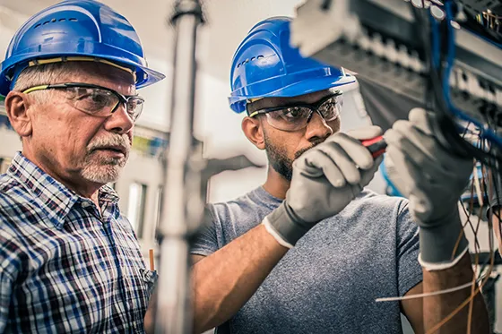 Electrician and apprentice