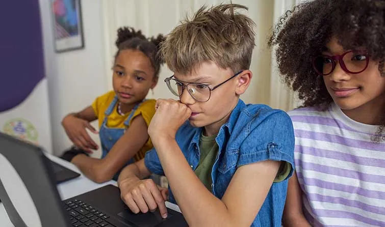 Middle school students at school computer