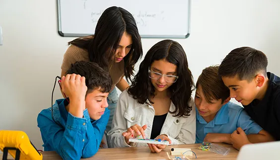 Middles school students working on a project