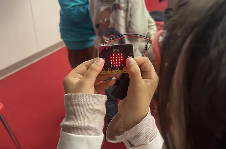 Girl holding microbit