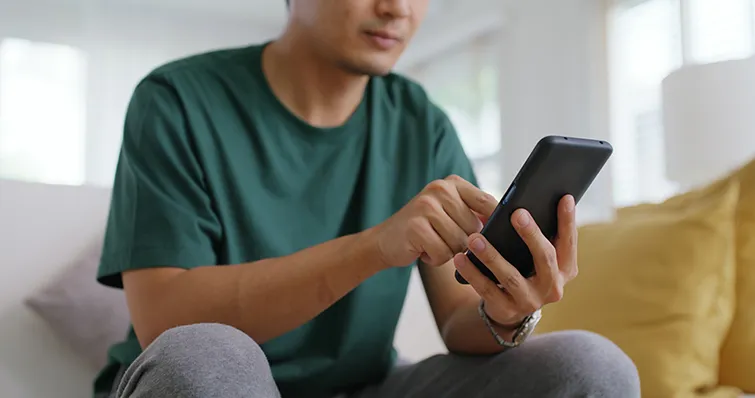 Parent looking at cell phone