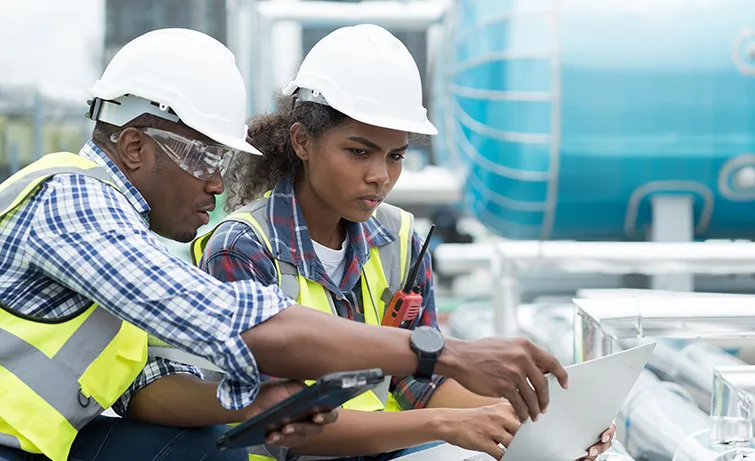 Construction apprentice with her trainer
