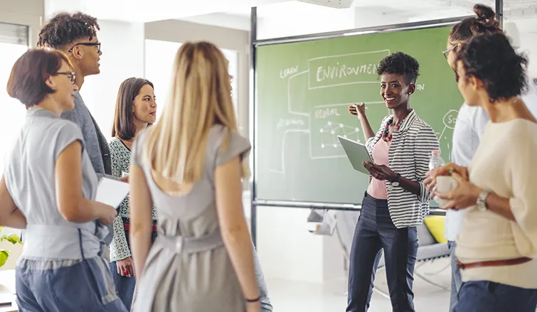 Teachers using computers in classroom