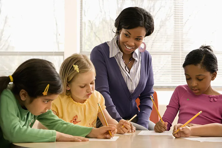 Teacher with young math students