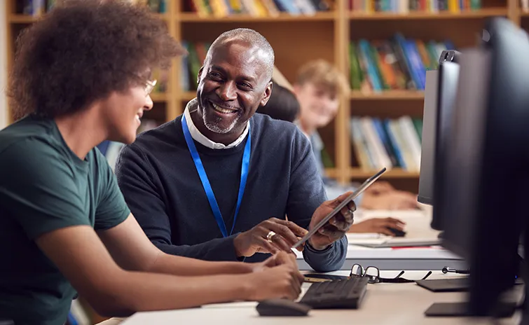 African American mentor and mentee laughing together