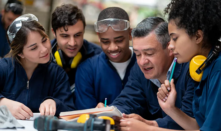 Factory workers with supervisor