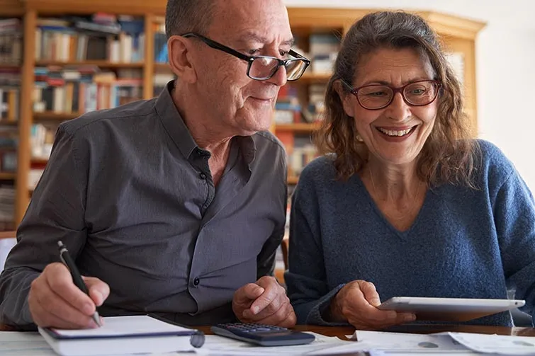 Older couple reading through documents