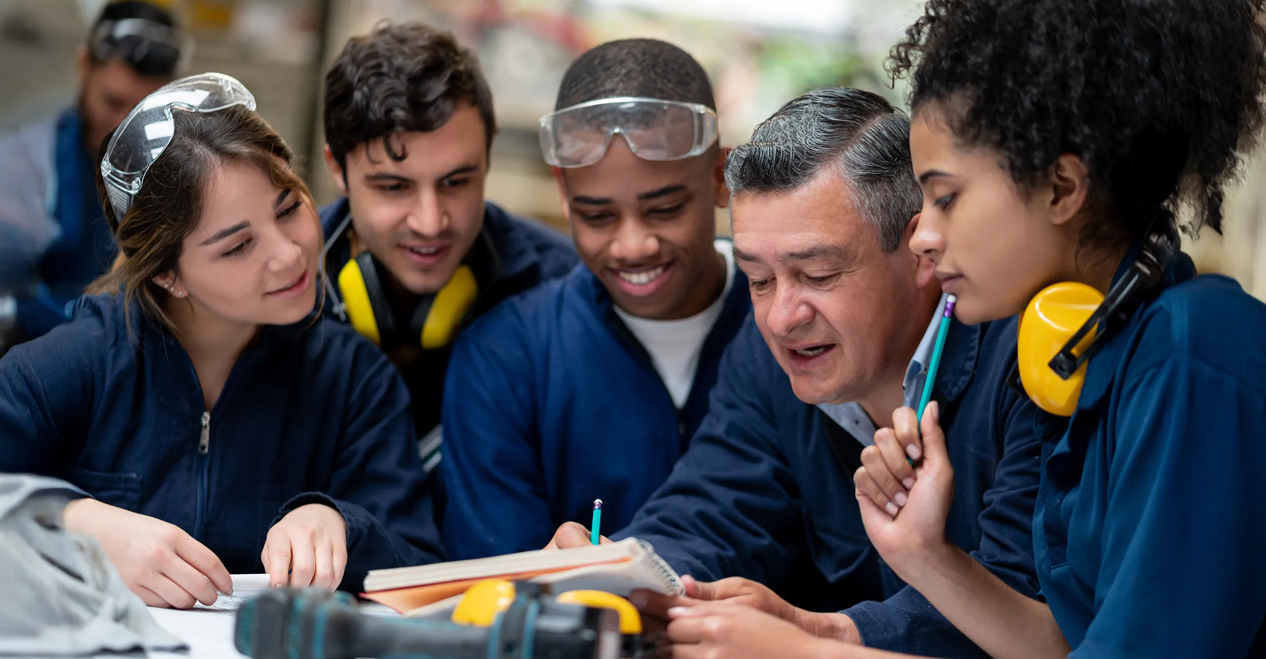 Factory workers with supervisor
