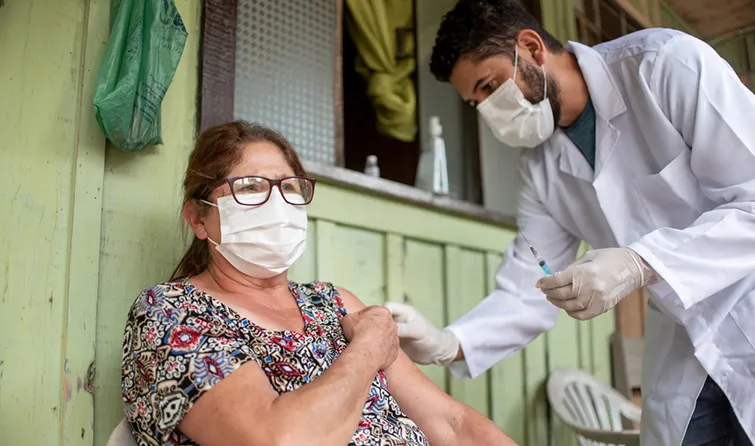 Woman receiving vaccination in rural clinic
