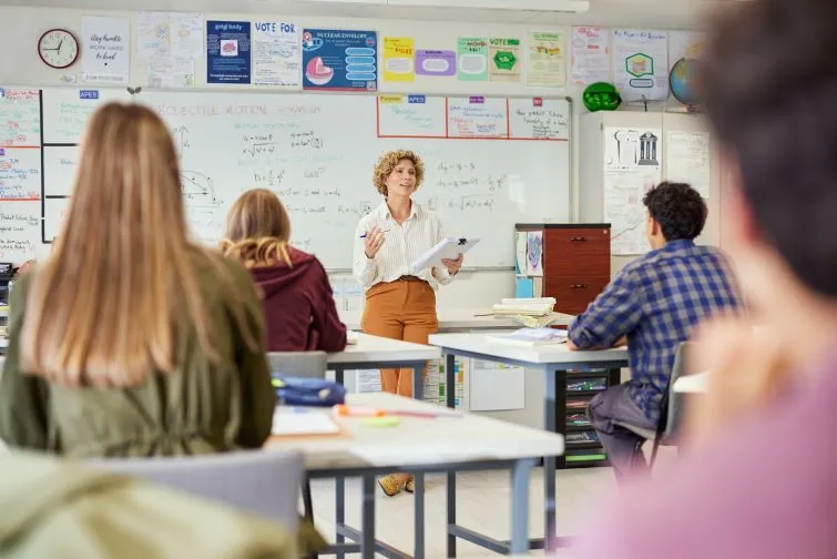 Teacher discussing assignment in class