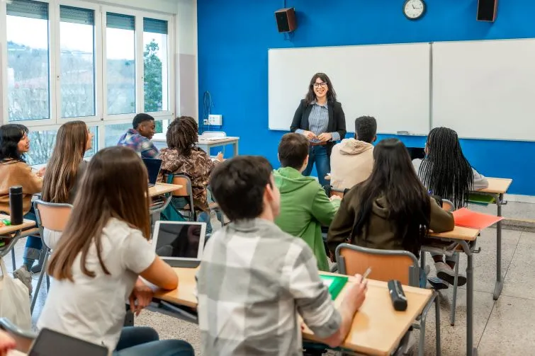 Teacher talking to students in classroom