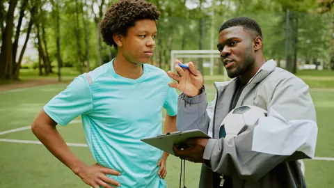 Teen and mentor on the soccer field