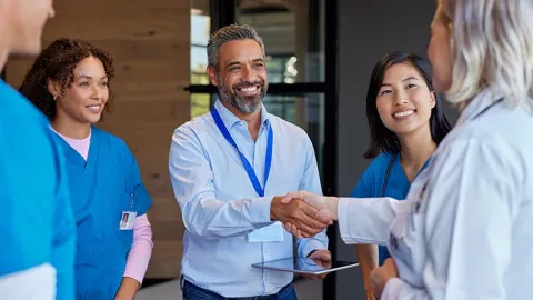 Health care workers in conversation