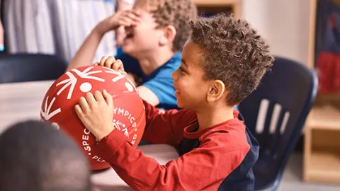 Boy with Special Olympics soccer ball