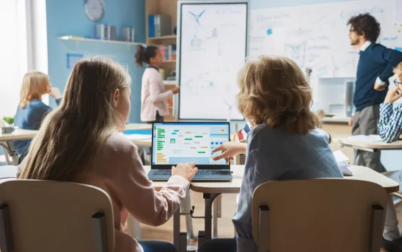 Children working together on a laptop