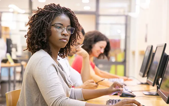 Girl with glasses at computer