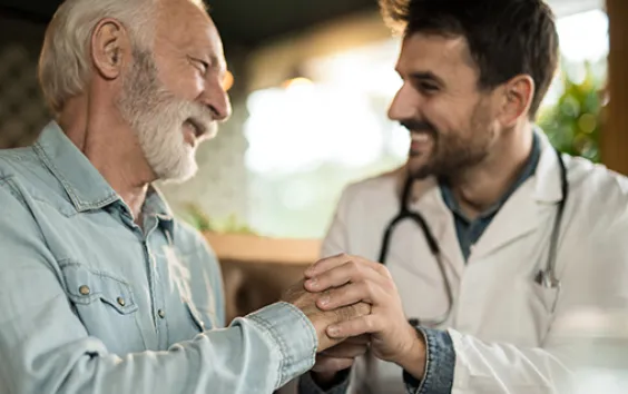 Rural doctor talking to older patient