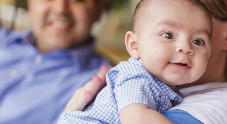 Baby in gingham onesie