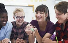Image of teacher with middle school students