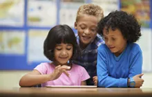 Three kids with an iPad