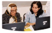 teacher working with an adult learner woman 