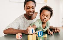 Image of mother and son playing with blocks