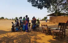 Image of mothers and young children outside in Mozambique 