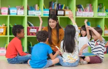 Image of teacher and young students 