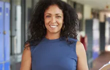 Image of principal in a hallway
