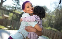 Woman and child hugging
