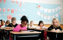 Young children taking a test in a classroom