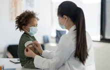 Doctor and smiling child patient