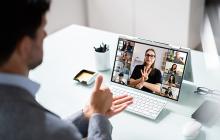 Colleagues using sign language during a virtual meeting