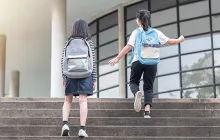 Kids on school stairs outside