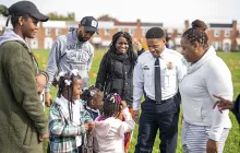 Baltimore police officer with community members