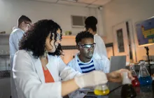 High school students performing a chemistry experiment