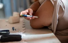 Woman injecting herself with insulin