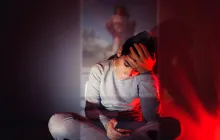 Sad teen on her phone