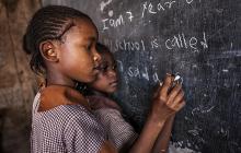 African girls at chalkboard
