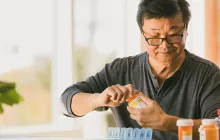 Older man with prescription bottle