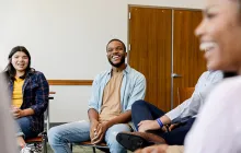 Smiling young people in a therapy group