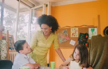 Teacher with two young students
