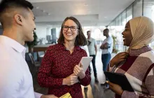 Diverse colleagues laughing