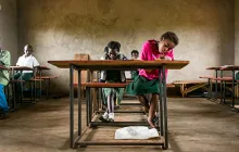 Student working at a desk in Zambia