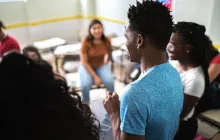 High school student giving presentation to class