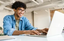 Young businessman at laptop