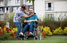 Handicapped boy spending time with his father in a wheelchair