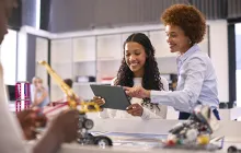 High school student with STEM teacher