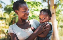 African mother holding her toddler