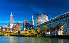 Downtown Cleveland with River, Bridge, Trees, and Deep Blue Sky 